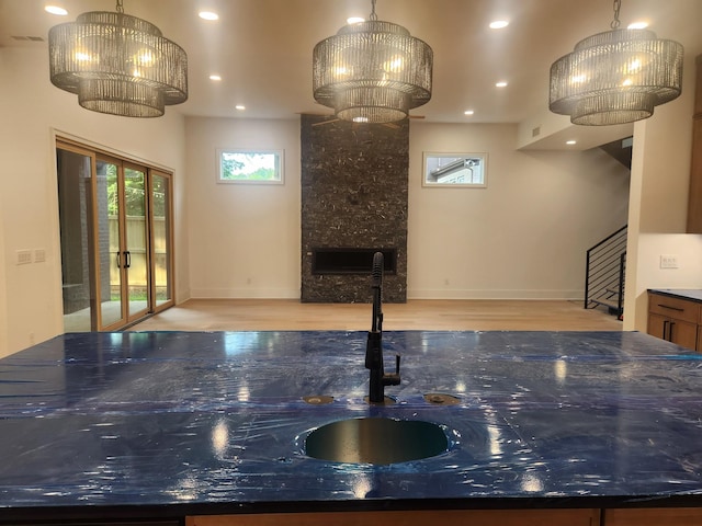 4026B Lealand Ln, Nashville, TN 37204 - kitchen with wood finished floors, recessed lighting, a fireplace, pendant lighting, and a chandelier