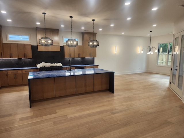 4026B Lealand Ln, Nashville, TN 37204 - kitchen featuring a chandelier, light wood-style flooring, tasteful backsplash, a large island, and recessed lighting