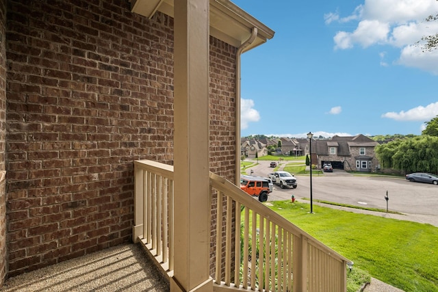 balcony with a residential view and covered porch