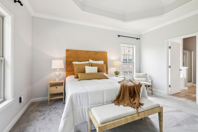 bedroom featuring light carpet, crown molding, and baseboards