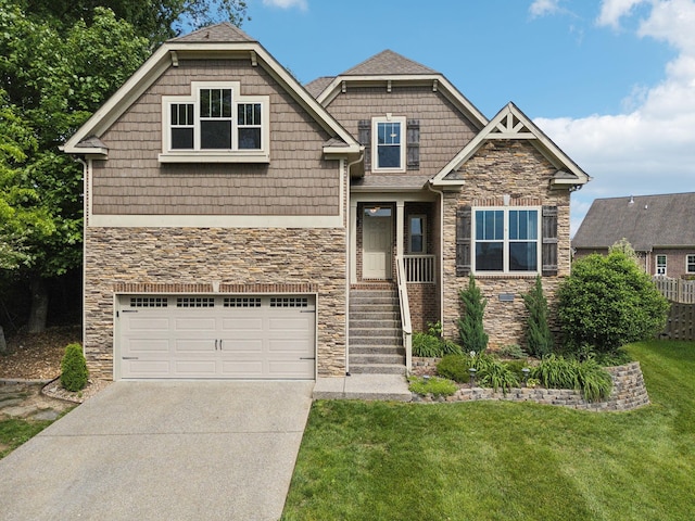 craftsman house featuring stone siding, an attached garage, concrete driveway, and a front yard