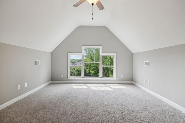 additional living space with carpet, a ceiling fan, lofted ceiling, and baseboards