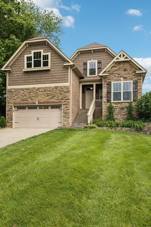 craftsman inspired home featuring a garage, stone siding, driveway, and a front lawn