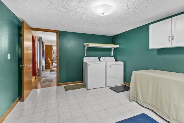 170 School House Ln, Castalian Springs, TN 37031 - washroom with separate washer and dryer, baseboards, a textured ceiling, and light floors