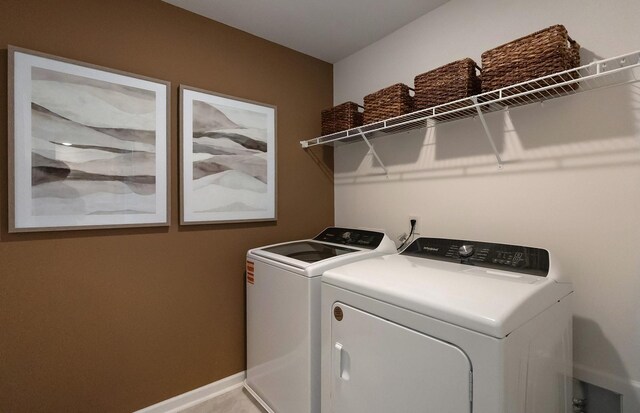 3292 Barrel Oak Pass, Columbia, TN 38401 - clothes washing area featuring washing machine and clothes dryer and baseboards