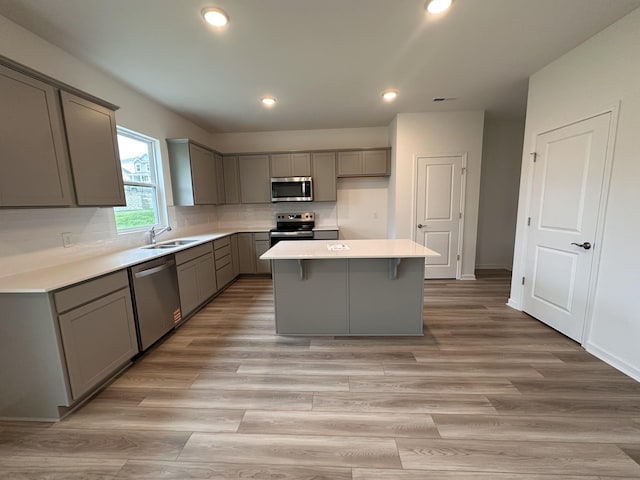 3292 Barrel Oak Pass, Columbia, TN 38401 - kitchen featuring stainless steel appliances, gray cabinetry, a sink, a center island, and recessed lighting