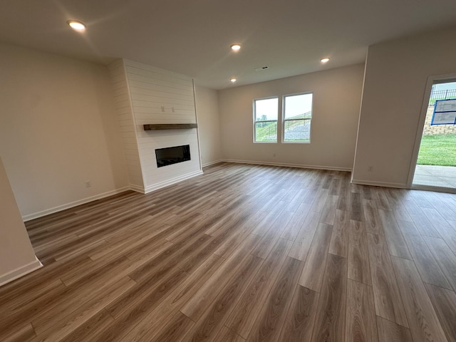 3292 Barrel Oak Pass, Columbia, TN 38401 - unfurnished living room with a fireplace, wood finished floors, baseboards, and recessed lighting