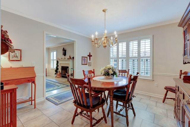 dining room with a chandelier, ornamental molding, a fireplace, light tile patterned floors, and baseboards