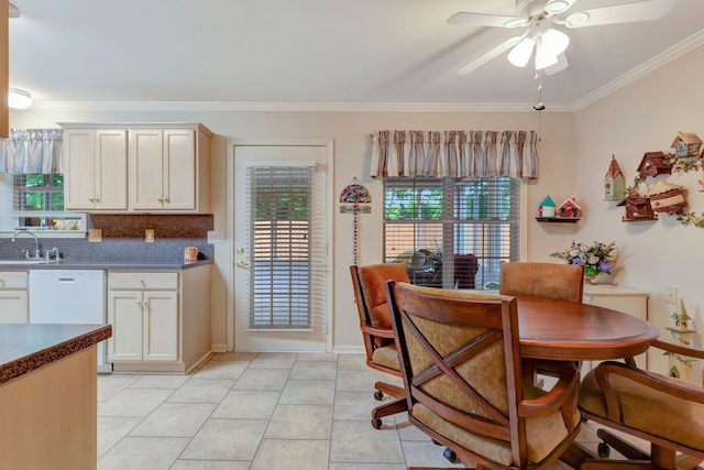 dining room featuring a ceiling fan, ornamental molding, light tile patterned floors, and baseboards