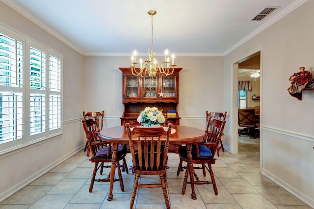 dining room with crown molding, a chandelier, light tile patterned floors, and baseboards