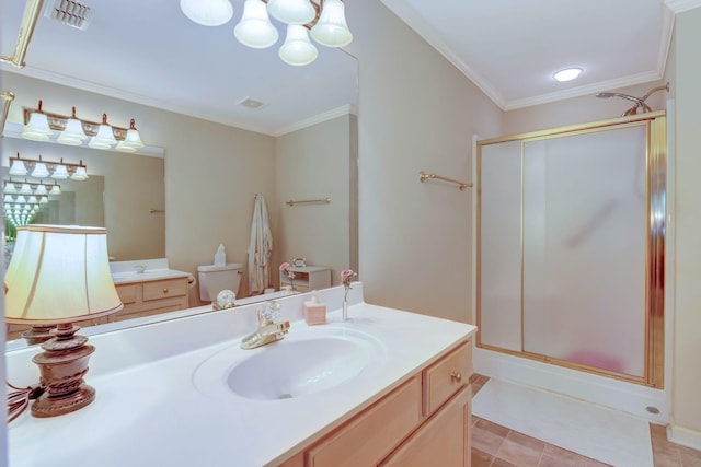 full bathroom with a shower stall, ornamental molding, vanity, toilet, and tile patterned floors