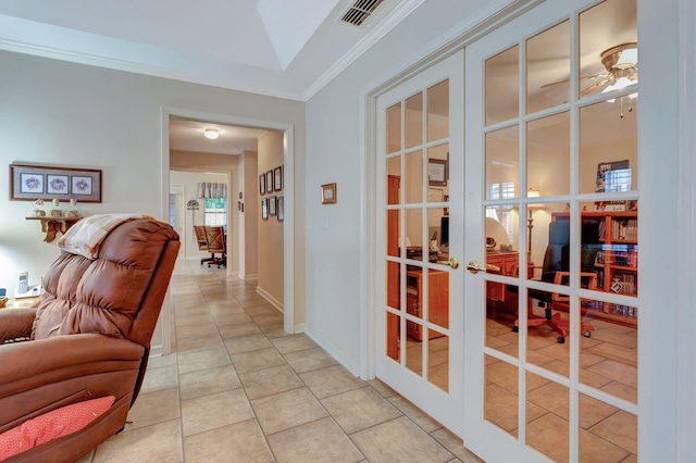 hallway with french doors, light tile patterned floors, crown molding, and lofted ceiling