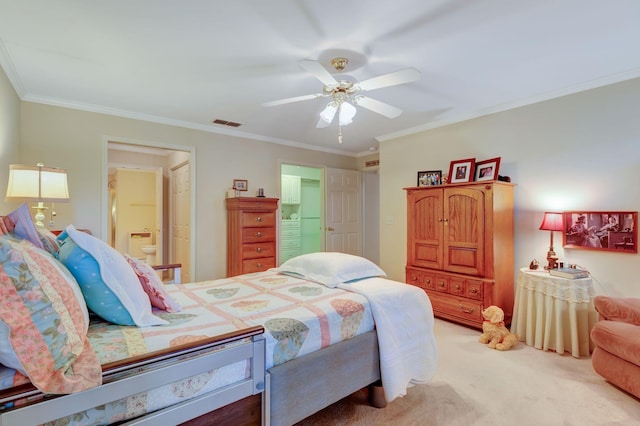 carpeted bedroom featuring ornamental molding, ensuite bathroom, and ceiling fan