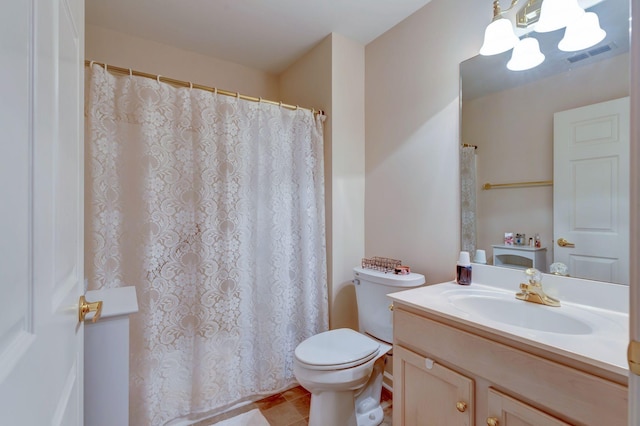 full bathroom with vanity, toilet, and tile patterned flooring