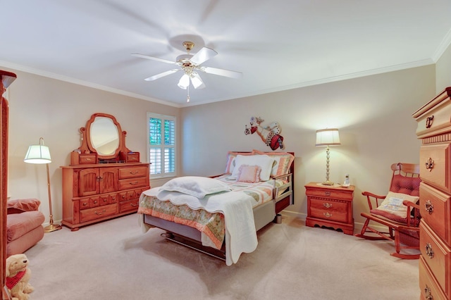bedroom with light colored carpet, crown molding, ceiling fan, and baseboards
