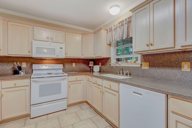 kitchen featuring white appliances, a sink, light tile patterned flooring, crown molding, and cream cabinetry