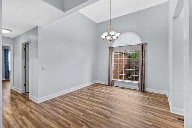 203 Abbigael Dr, Portland, TN 37148 - unfurnished dining area with wood finished floors, baseboards, and a chandelier