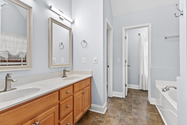 203 Abbigael Dr, Portland, TN 37148 - full bath featuring baseboards, a garden tub, and double vanity