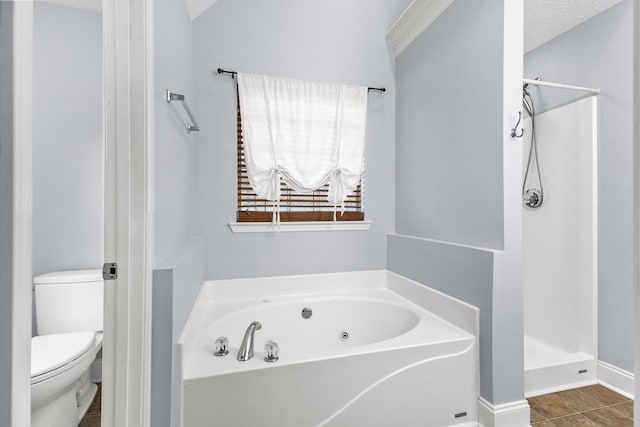 203 Abbigael Dr, Portland, TN 37148 - bathroom with a shower stall, toilet, a garden tub, and tile patterned flooring
