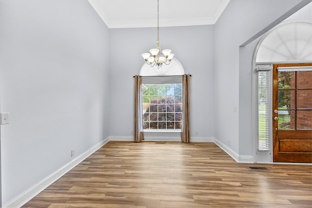 203 Abbigael Dr, Portland, TN 37148 - entryway with a chandelier, plenty of natural light, wood finished floors, and crown molding