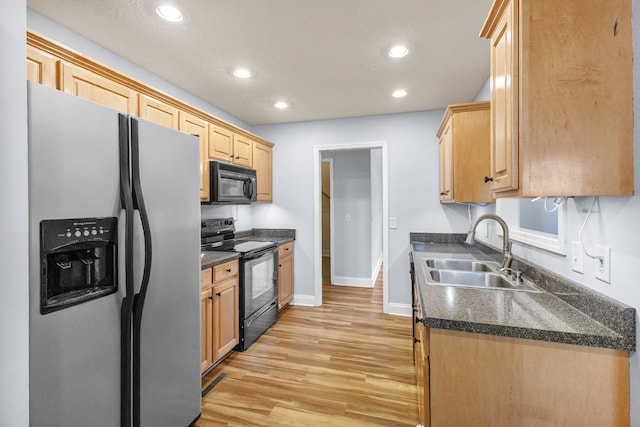 203 Abbigael Dr, Portland, TN 37148 - kitchen featuring black appliances, a sink, light wood finished floors, recessed lighting, and baseboards