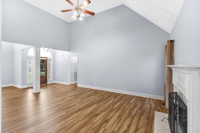 203 Abbigael Dr, Portland, TN 37148 - unfurnished living room featuring a ceiling fan, a fireplace with flush hearth, light wood finished floors, high vaulted ceiling, and baseboards