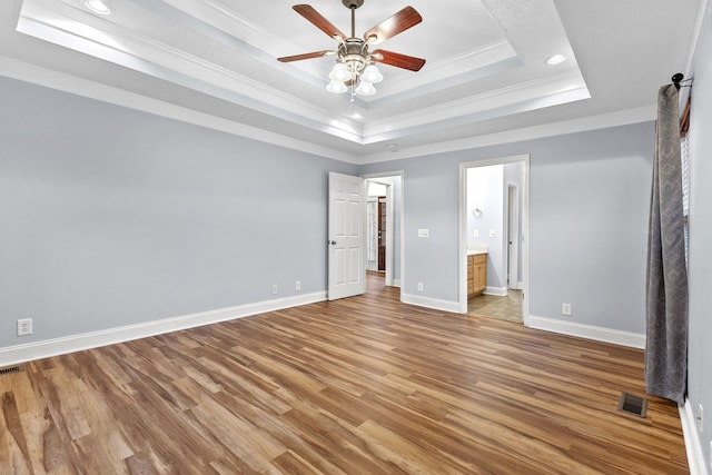 203 Abbigael Dr, Portland, TN 37148 - unfurnished bedroom with crown molding, light wood-style flooring, a tray ceiling, recessed lighting, and baseboards