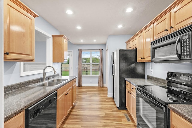 203 Abbigael Dr, Portland, TN 37148 - kitchen with black appliances, a sink, light wood-type flooring, light brown cabinets, and recessed lighting