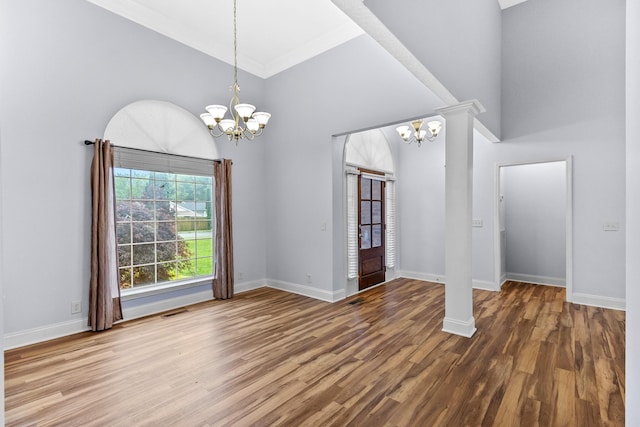 203 Abbigael Dr, Portland, TN 37148 - unfurnished dining area with a chandelier, high vaulted ceiling, wood finished floors, baseboards, and crown molding