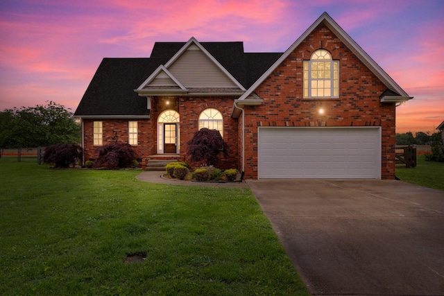 203 Abbigael Dr, Portland, TN 37148 - traditional-style house with an attached garage, concrete driveway, brick siding, and a lawn