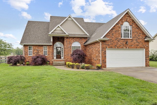203 Abbigael Dr, Portland, TN 37148 - traditional home featuring brick siding, concrete driveway, a front lawn, a shingled roof, and a garage