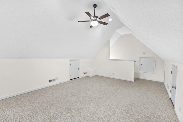 203 Abbigael Dr, Portland, TN 37148 - additional living space featuring lofted ceiling, light colored carpet, baseboards, ceiling fan, and a textured ceiling