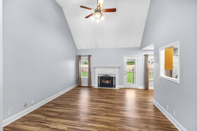 203 Abbigael Dr, Portland, TN 37148 - unfurnished living room with a ceiling fan, a high end fireplace, high vaulted ceiling, dark wood finished floors, and baseboards