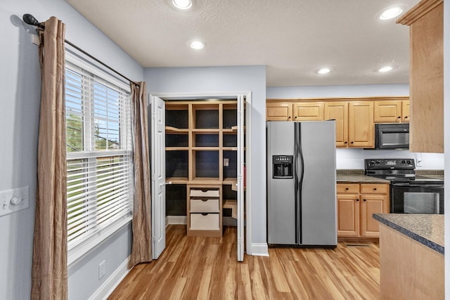 203 Abbigael Dr, Portland, TN 37148 - kitchen featuring black appliances, light wood-style floors, dark countertops, recessed lighting, and light brown cabinets