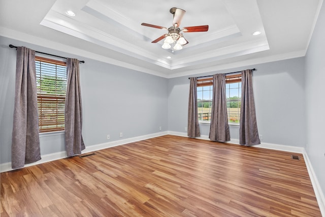 203 Abbigael Dr, Portland, TN 37148 - empty room featuring light wood finished floors, crown molding, a tray ceiling, ceiling fan, and baseboards