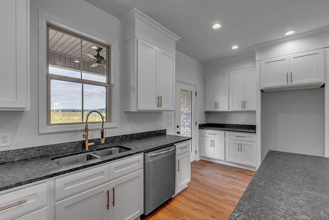 kitchen with dishwasher, a sink, white cabinetry, light wood-style floors, and recessed lighting