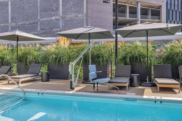 community pool with a wooden deck