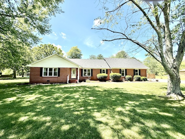 ranch-style house featuring brick siding, a front yard, and crawl space