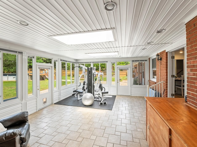 exercise room with a skylight and plenty of natural light