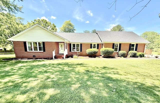 ranch-style house featuring brick siding, a front lawn, and crawl space