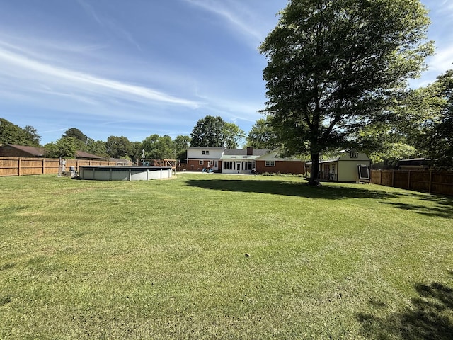 view of yard with a storage unit and an outdoor structure
