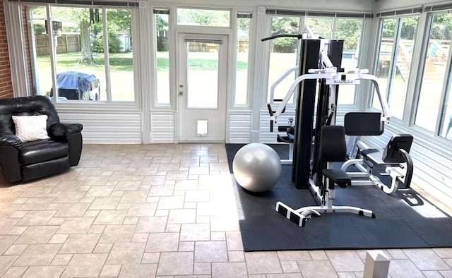 workout area with stone tile flooring and healthy amount of natural light