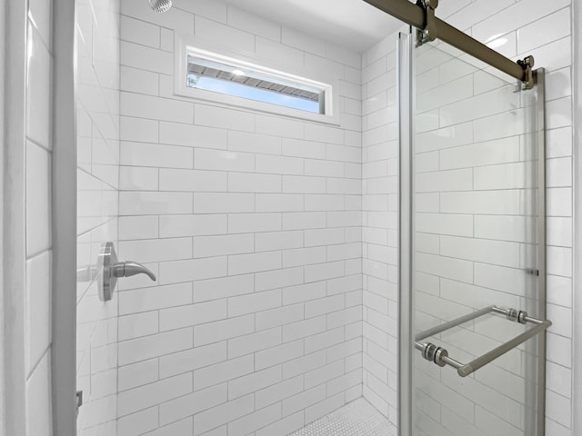 bathroom featuring a shower stall