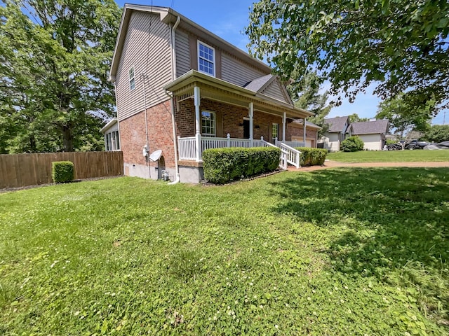 view of front of house with covered porch and brick siding