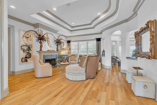 1041 Albatross Way, Gallatin, TN 37066 - living room featuring a tray ceiling, crown molding, wood finished floors, a premium fireplace, and baseboards