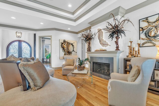 1041 Albatross Way, Gallatin, TN 37066 - living room featuring ornamental molding, french doors, a tile fireplace, wood finished floors, and recessed lighting