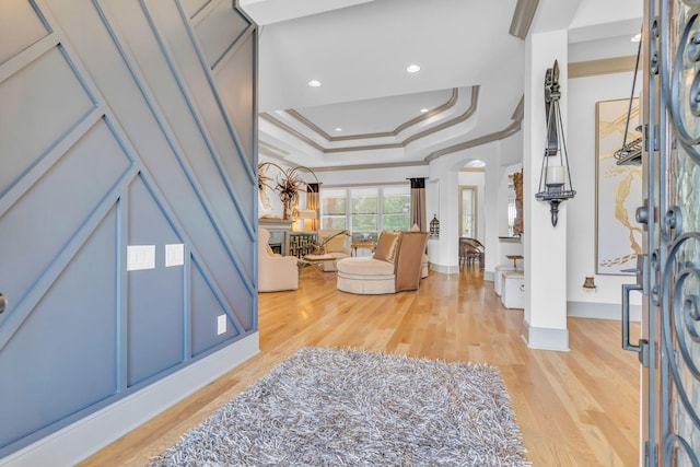 1041 Albatross Way, Gallatin, TN 37066 - entryway featuring wood finished floors, ornamental molding, baseboards, arched walkways, and a raised ceiling