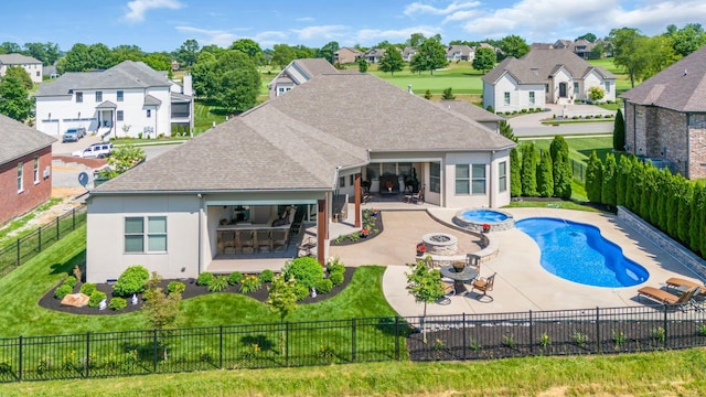 1041 Albatross Way, Gallatin, TN 37066 - rear view of property featuring a patio, a shingled roof, driveway, and a residential view
