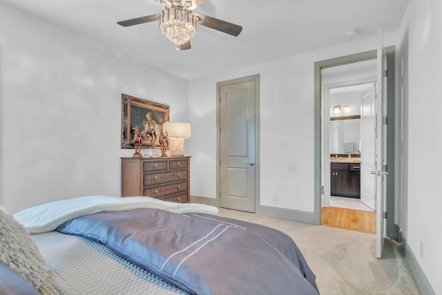 1041 Albatross Way, Gallatin, TN 37066 - bedroom featuring light colored carpet, baseboards, ceiling fan, and ensuite bathroom