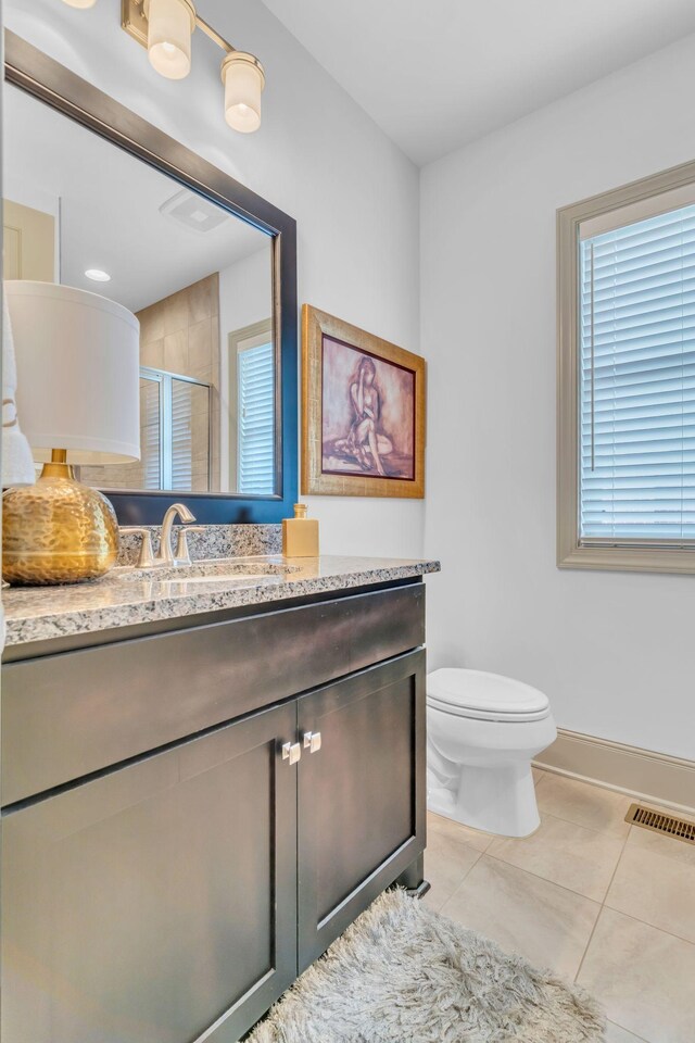 1041 Albatross Way, Gallatin, TN 37066 - bathroom featuring a shower stall, tile patterned flooring, toilet, vanity, and baseboards